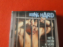 Load image into Gallery viewer, Vintage Adult Erotic Gay Interest VHS Movie Tape Doing Hard Time Dane Tarson 12