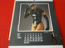 Load image into Gallery viewer, Vintage Large Semi-Nude Pinup Wall Calendar 1987 James Bond Girls 18 x 13.5    D
